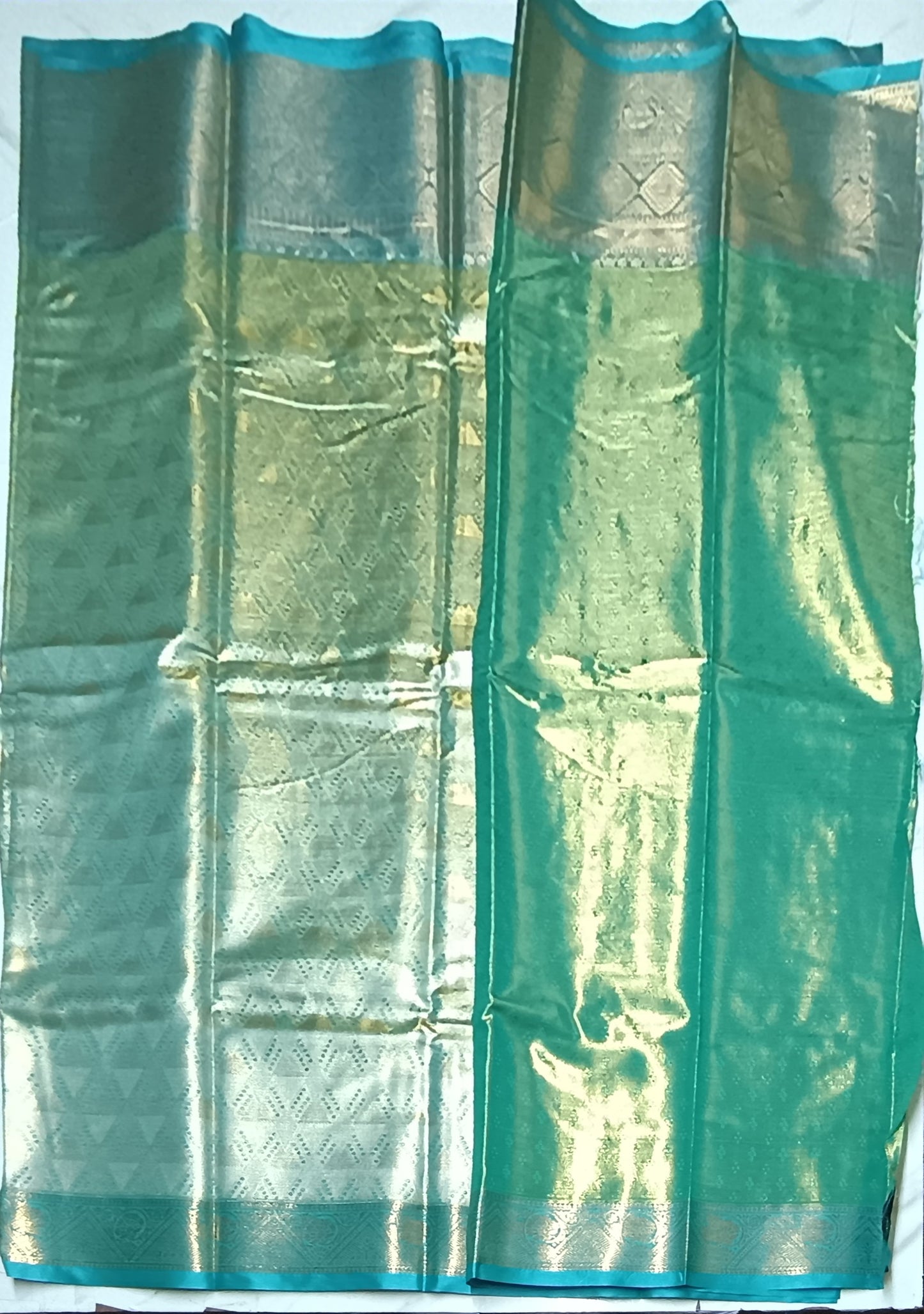 Gold and silver shaded Teal blue semi pattu saree