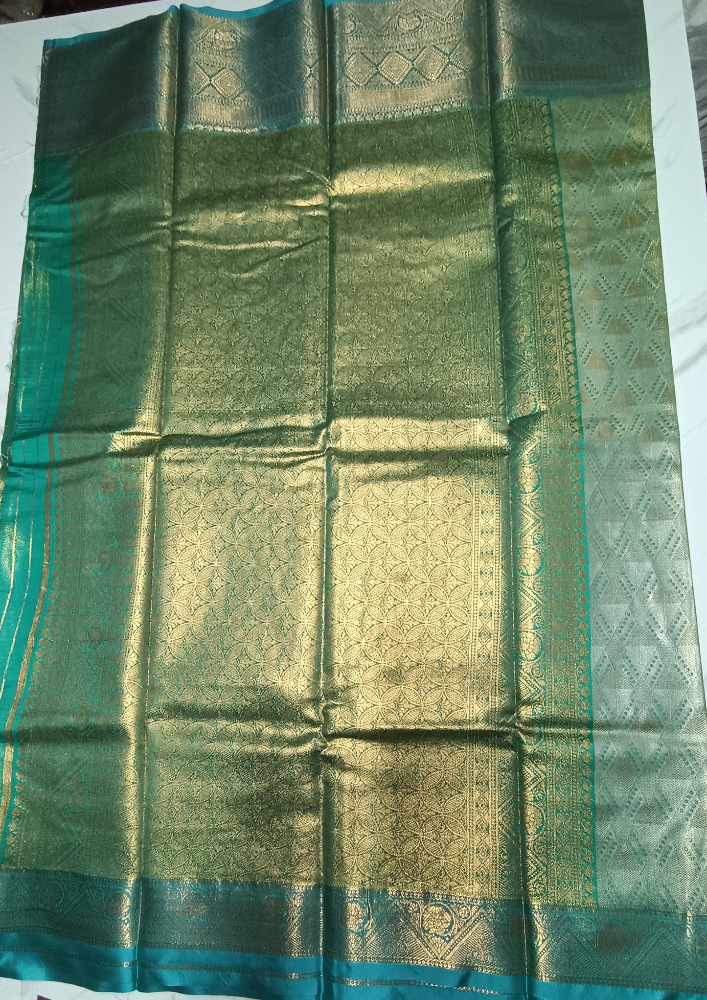 Gold and silver shaded Teal blue semi pattu saree